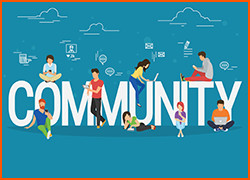 A group of people sitting among the letters spelling "Community"